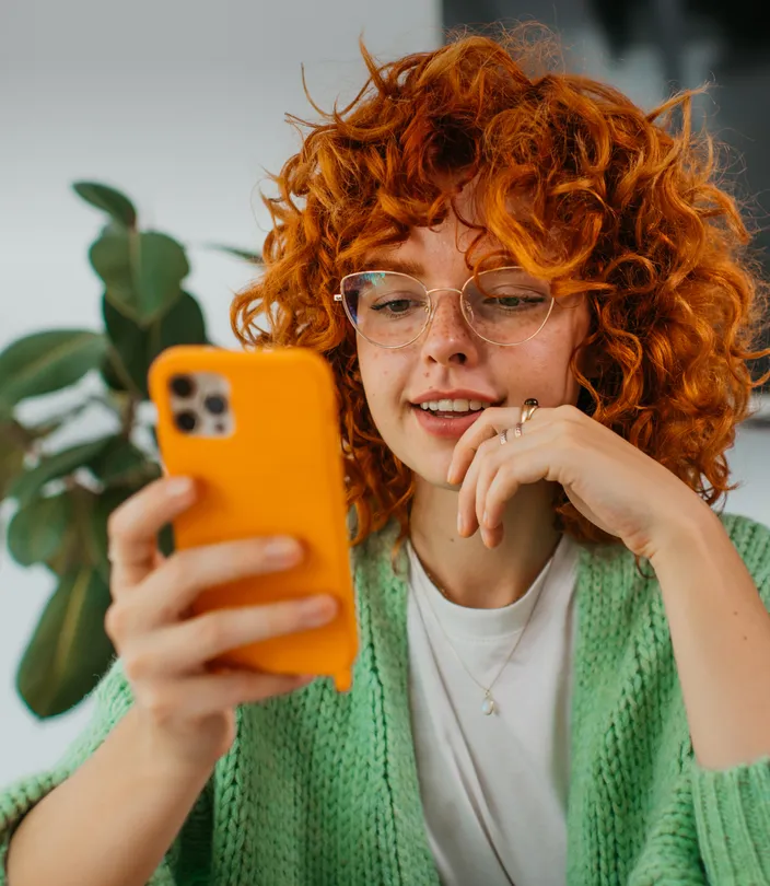 A woman picks a cyber extortion protection plan via the NordProtect app.