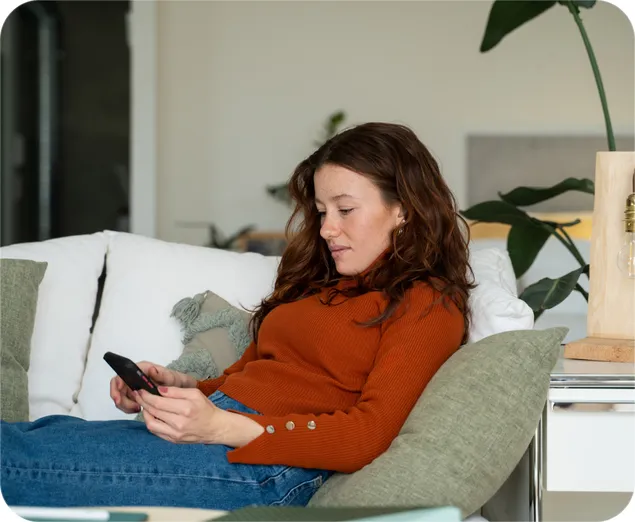 A woman tracks her credit activity with NordProtect.