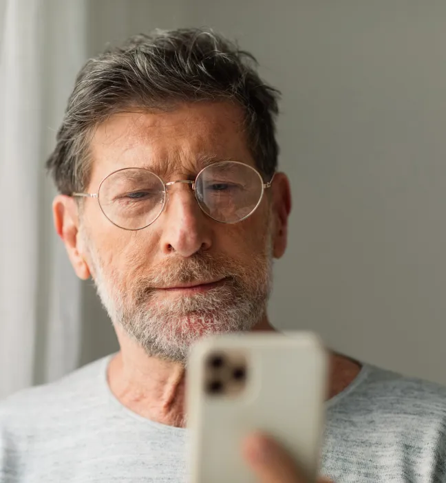 A man reviews NordProtect’s extra benefits, like identity theft recovery.