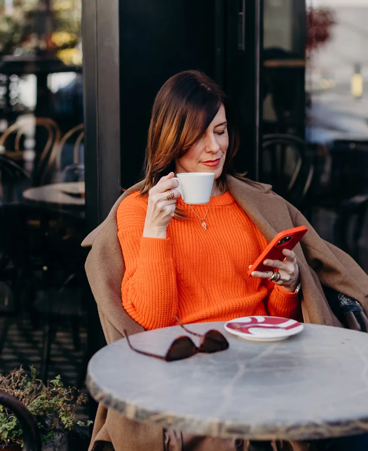 A woman reviews NordProtect’s features and benefits.