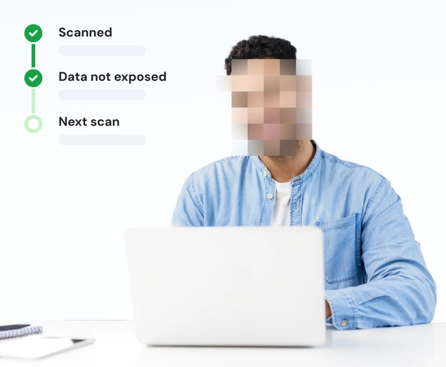 A man with a blurred face using a laptop to view his data protected by NordProtect and Incogni.