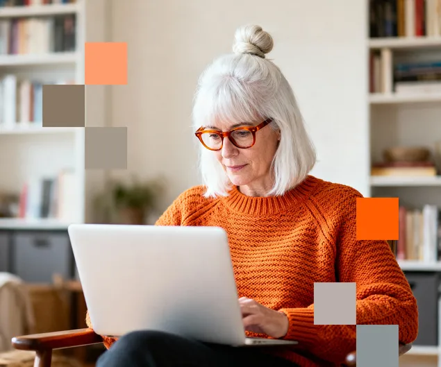 A woman using her laptop to review her NordProtect insurance benefits.